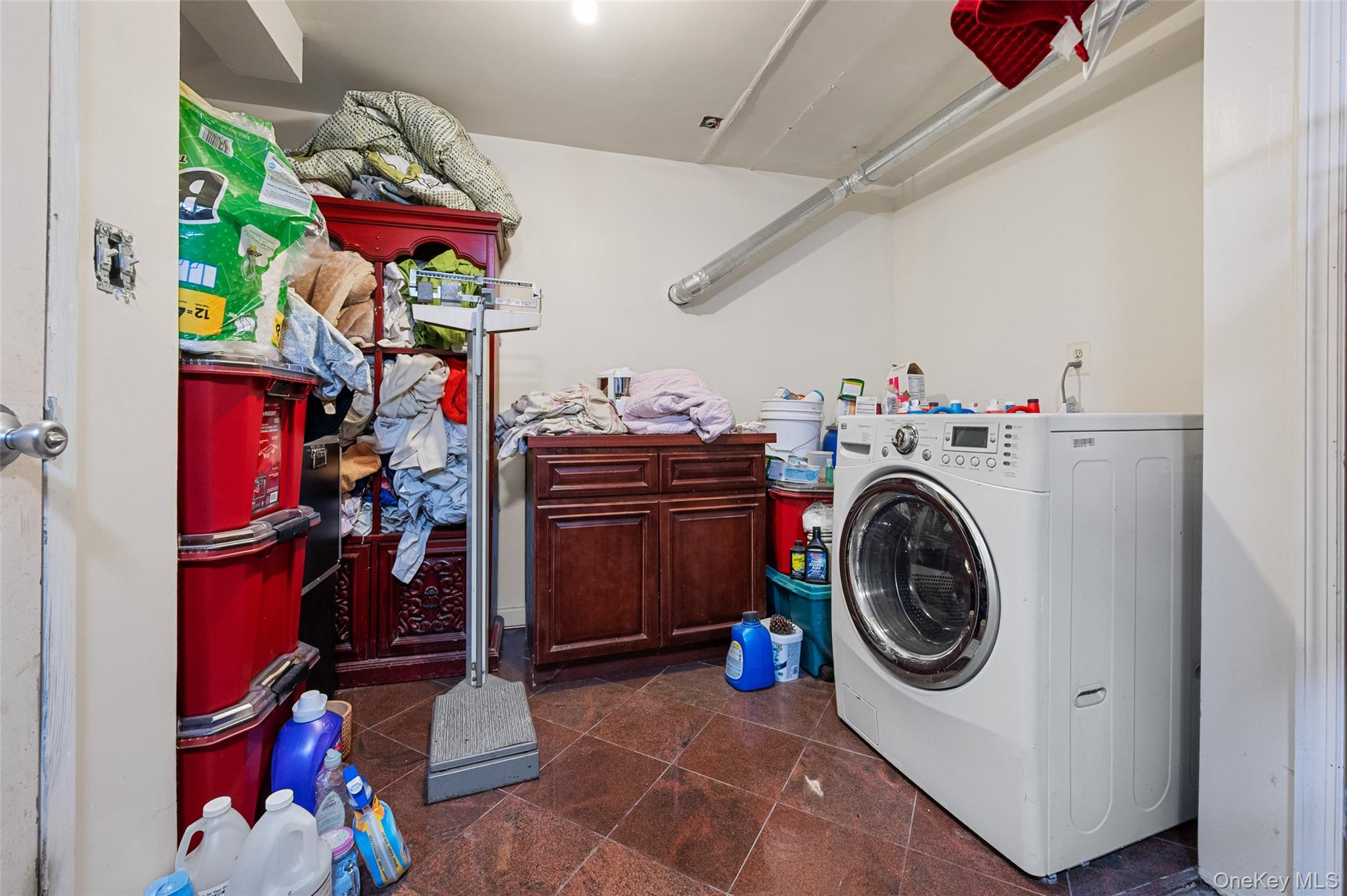 108-10 35th Avenue Queens, NY 11368 - Photo 15 of 29 Laundry room with washer / clothes dryer and cabinet space