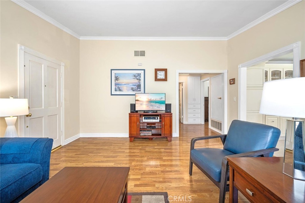 11253 Gardiners Court Cypress, CA 90630 - Photo 22 of 74 a living room with furniture and a dining table