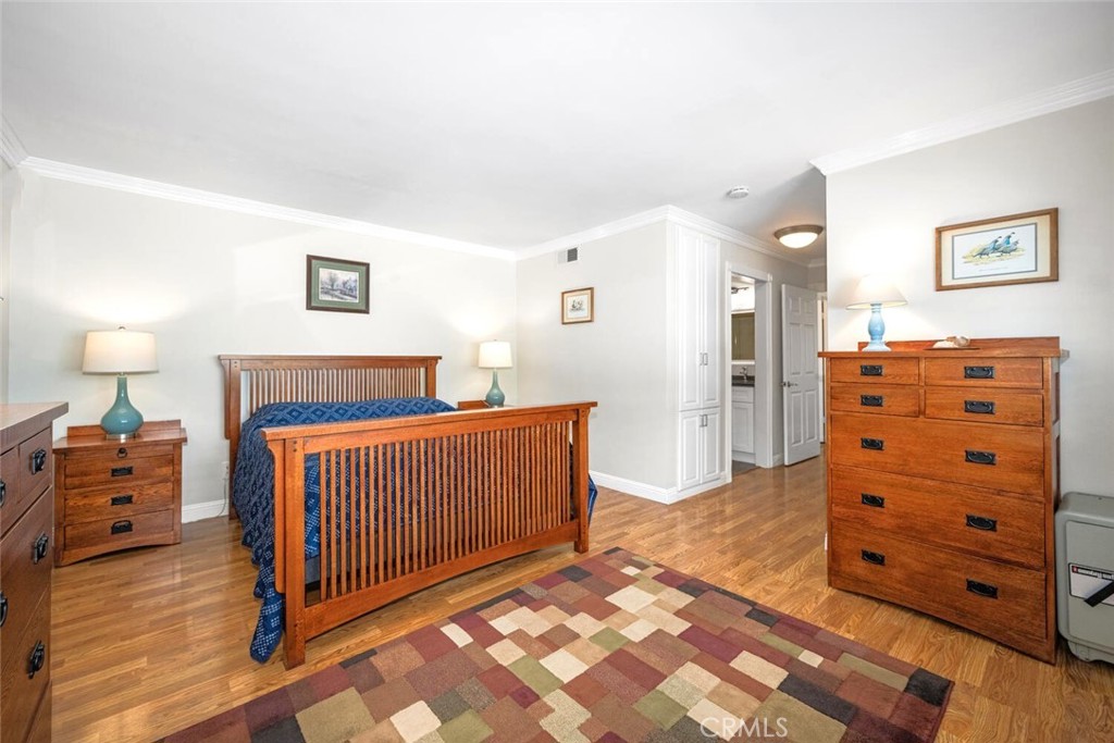 11253 Gardiners Court Cypress, CA 90630 - Photo 36 of 74 a bedroom with a dresser and a mirror