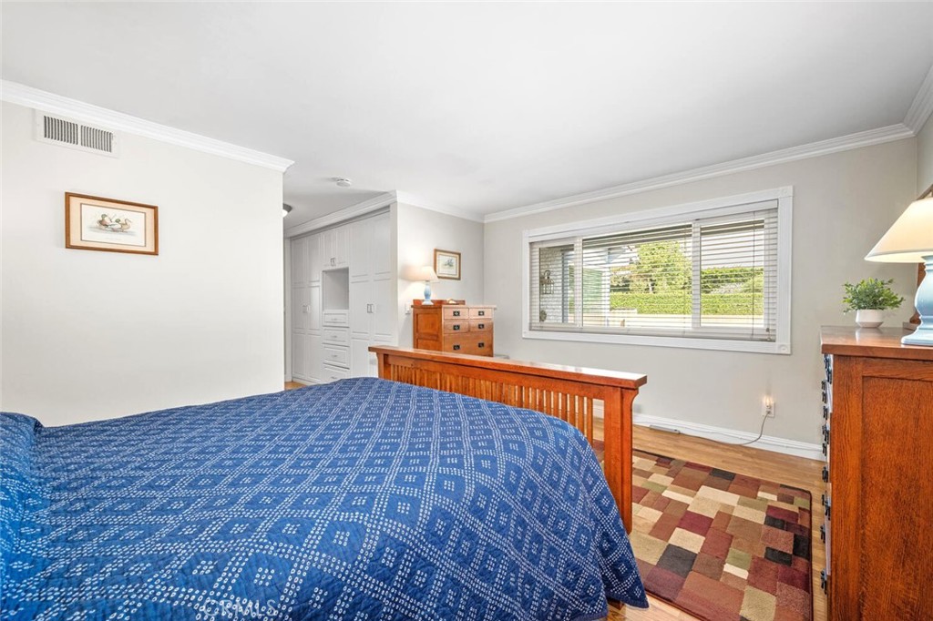 11253 Gardiners Court Cypress, CA 90630 - Photo 37 of 74 a bedroom with a bed and a window