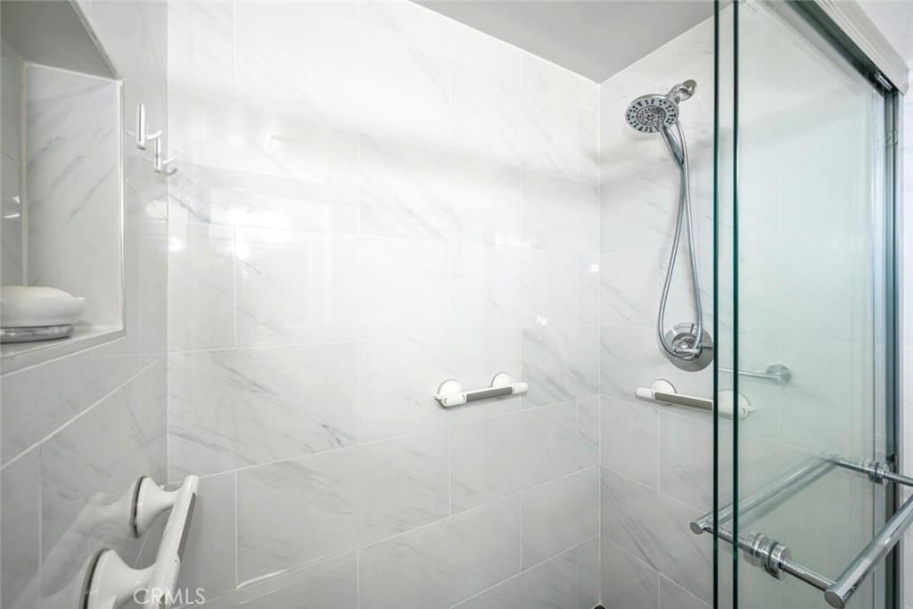 11253 Gardiners Court Cypress, CA 90630 - Photo 42 of 74 a bathroom with a shower