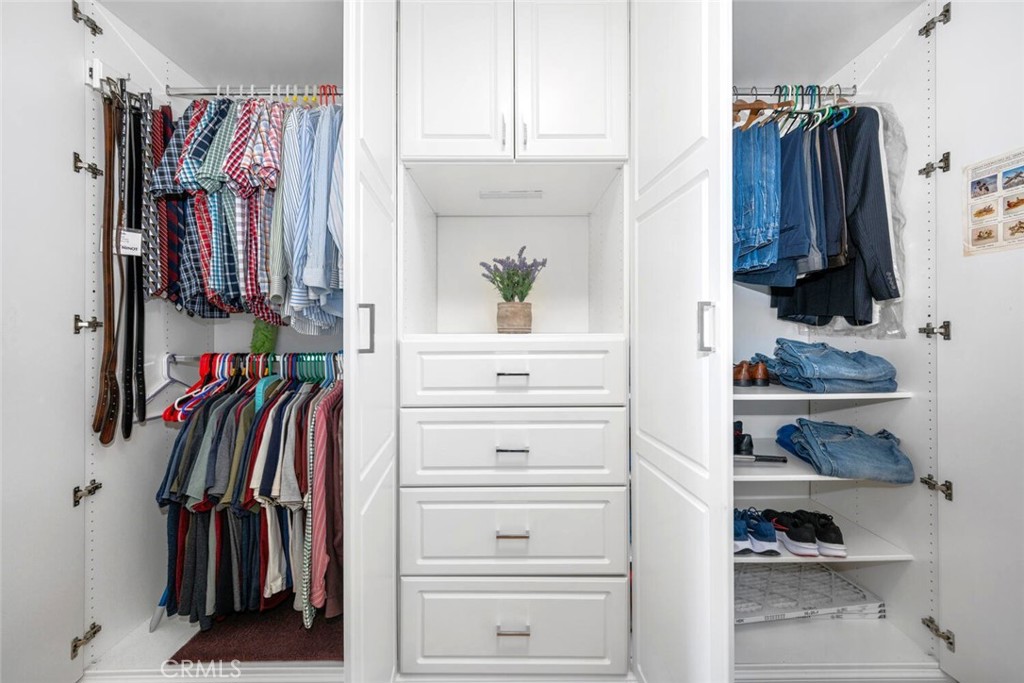 11253 Gardiners Court Cypress, CA 90630 - Photo 44 of 74 a view of walk in closet with clothes and shoes