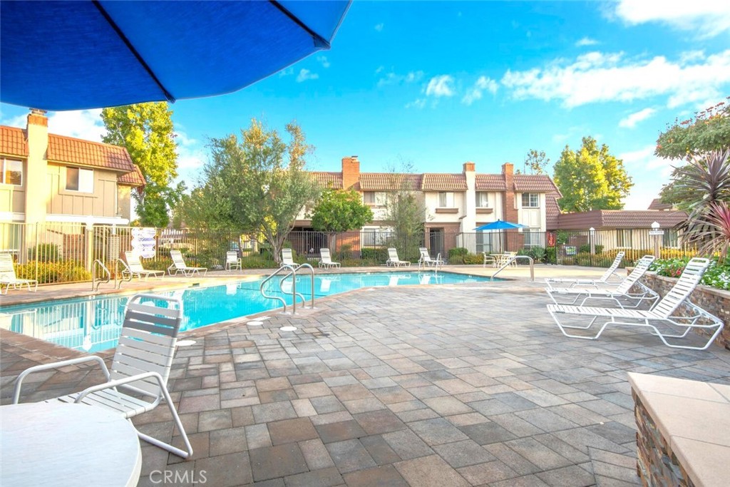 11253 Gardiners Court Cypress, CA 90630 - Photo 64 of 74 a view of swimming pool with outdoor seating and a yard
