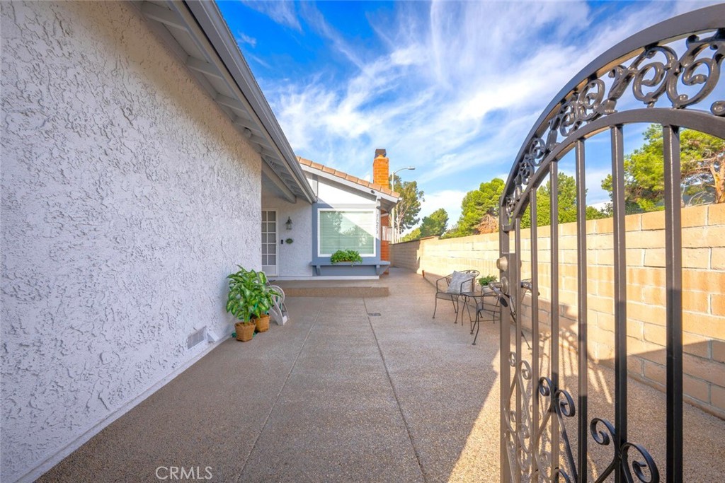 11253 Gardiners Court Cypress, CA 90630 - Photo 7 of 74 a dining room with furniture and a floor to ceiling window