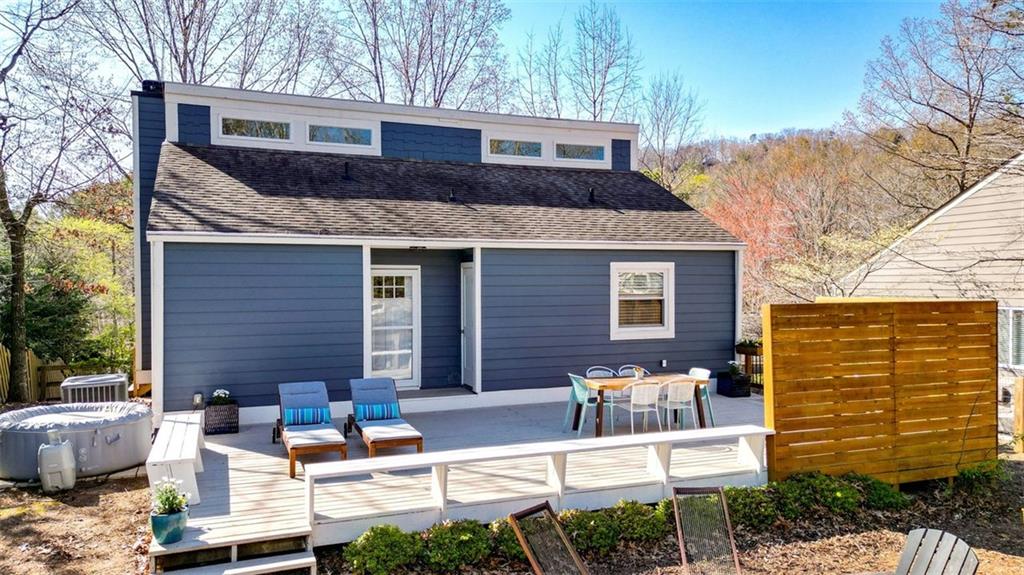 105 Narrows Loop Waleska, GA 30183 - Photo 1 of 1 a view of a patio with couches chairs and a fire pit
