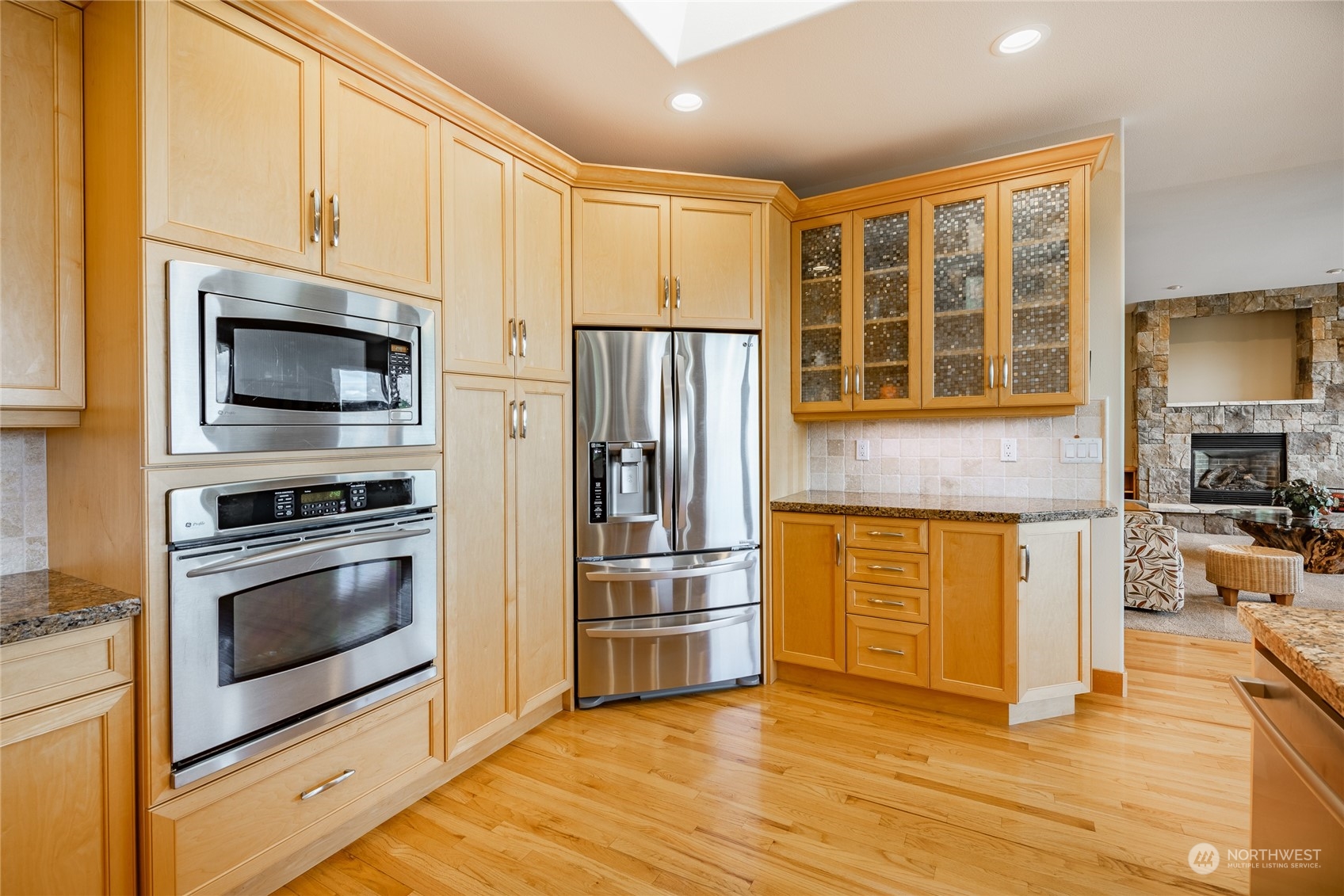 8148 Comox Road Blaine, WA 98230 - Photo 13 of 40 a kitchen with stainless steel appliances granite countertop a stove and a refrigerator