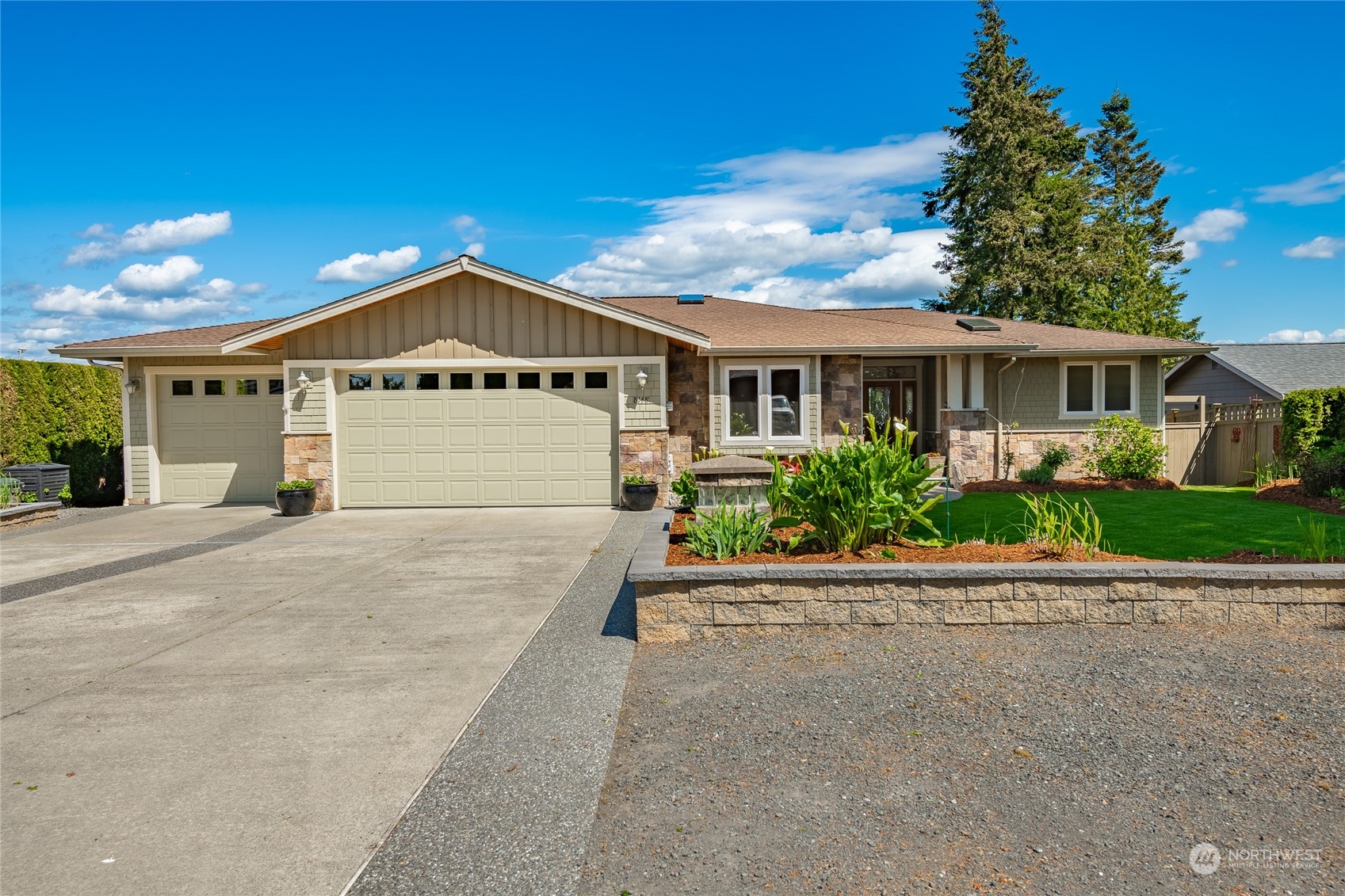 8148 Comox Road Blaine, WA 98230 - Photo 2 of 40 a front view of a house with a garden