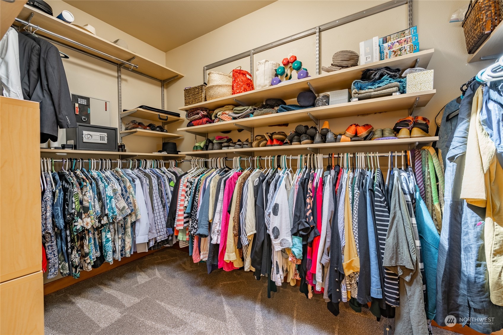 8148 Comox Road Blaine, WA 98230 - Photo 21 of 40 a view of walk in closet with clothes and shoes