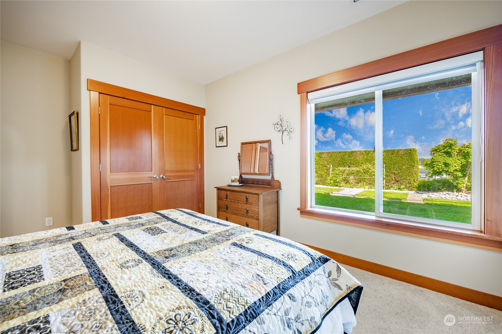 8148 Comox Road Blaine, WA 98230 - Photo 25 of 40 a bedroom with a bed and a flat screen tv