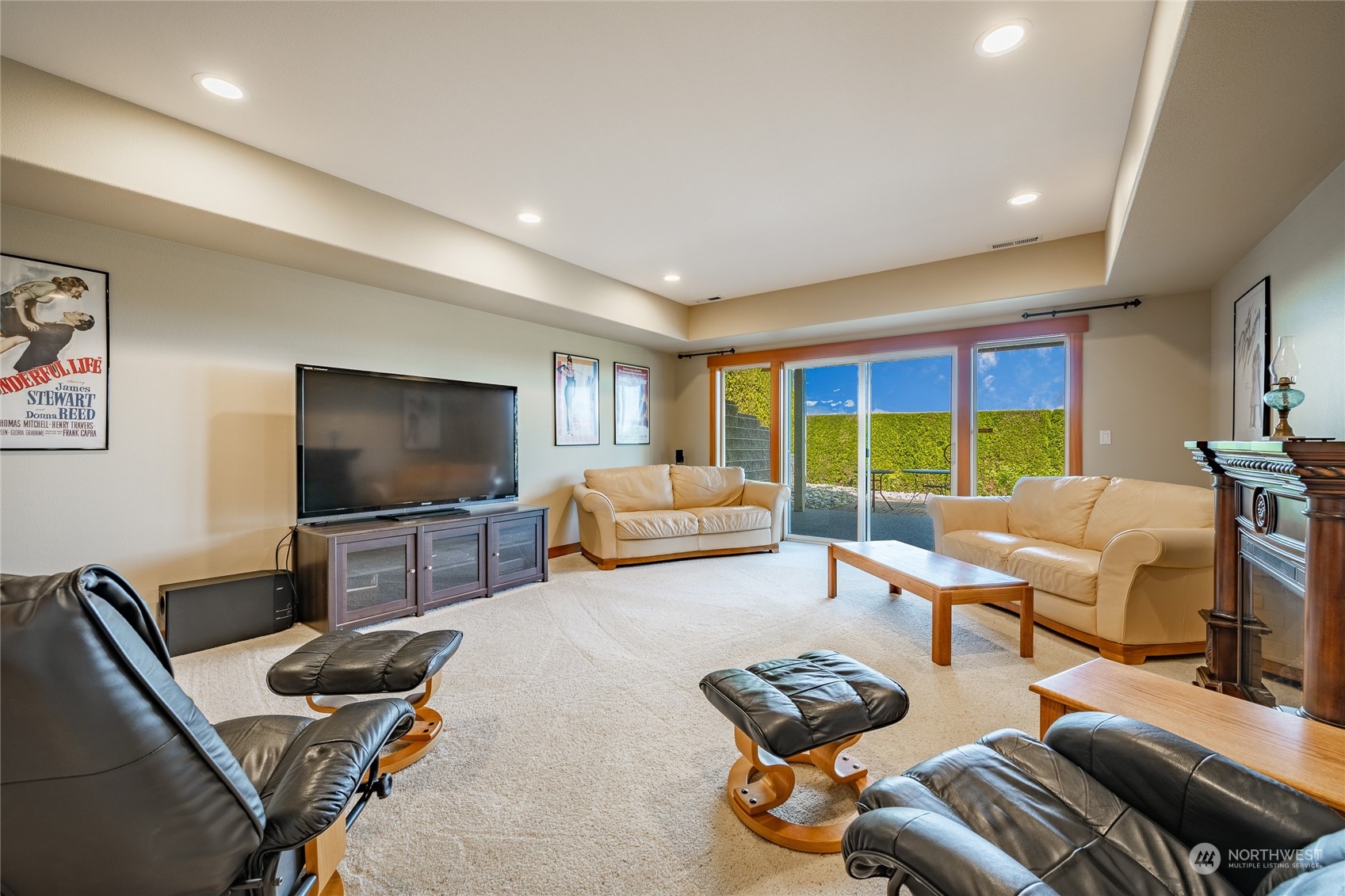 8148 Comox Road Blaine, WA 98230 - Photo 31 of 40 a bedroom with furniture and a flat screen tv