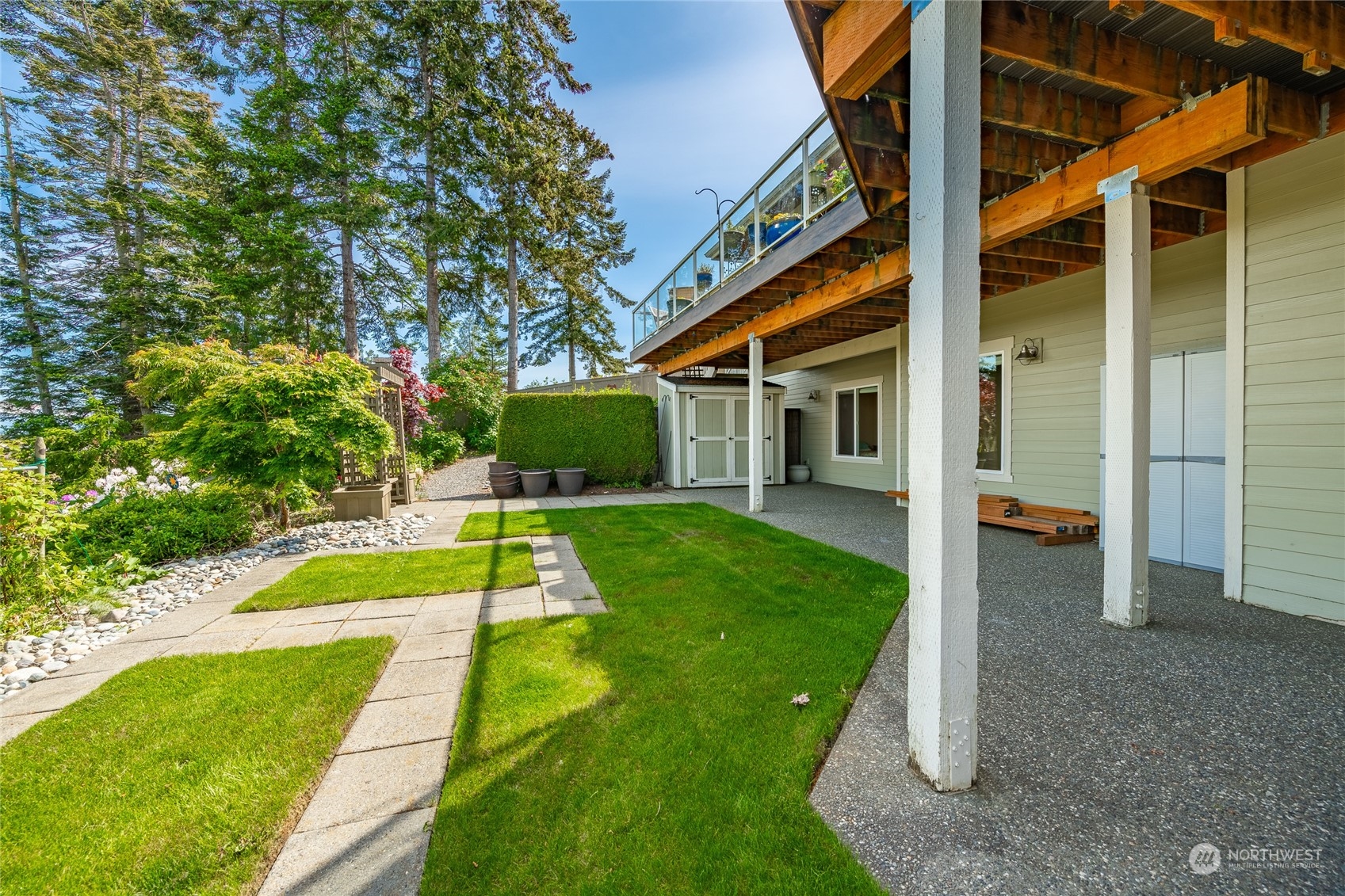 8148 Comox Road Blaine, WA 98230 - Photo 32 of 40 a view of a house with swimming pool and a yard