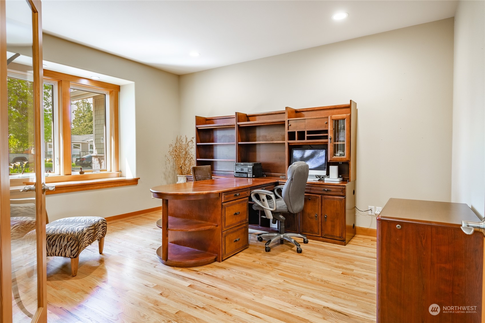 8148 Comox Road Blaine, WA 98230 - Photo 4 of 40 a view of a workspace with furniture and a window