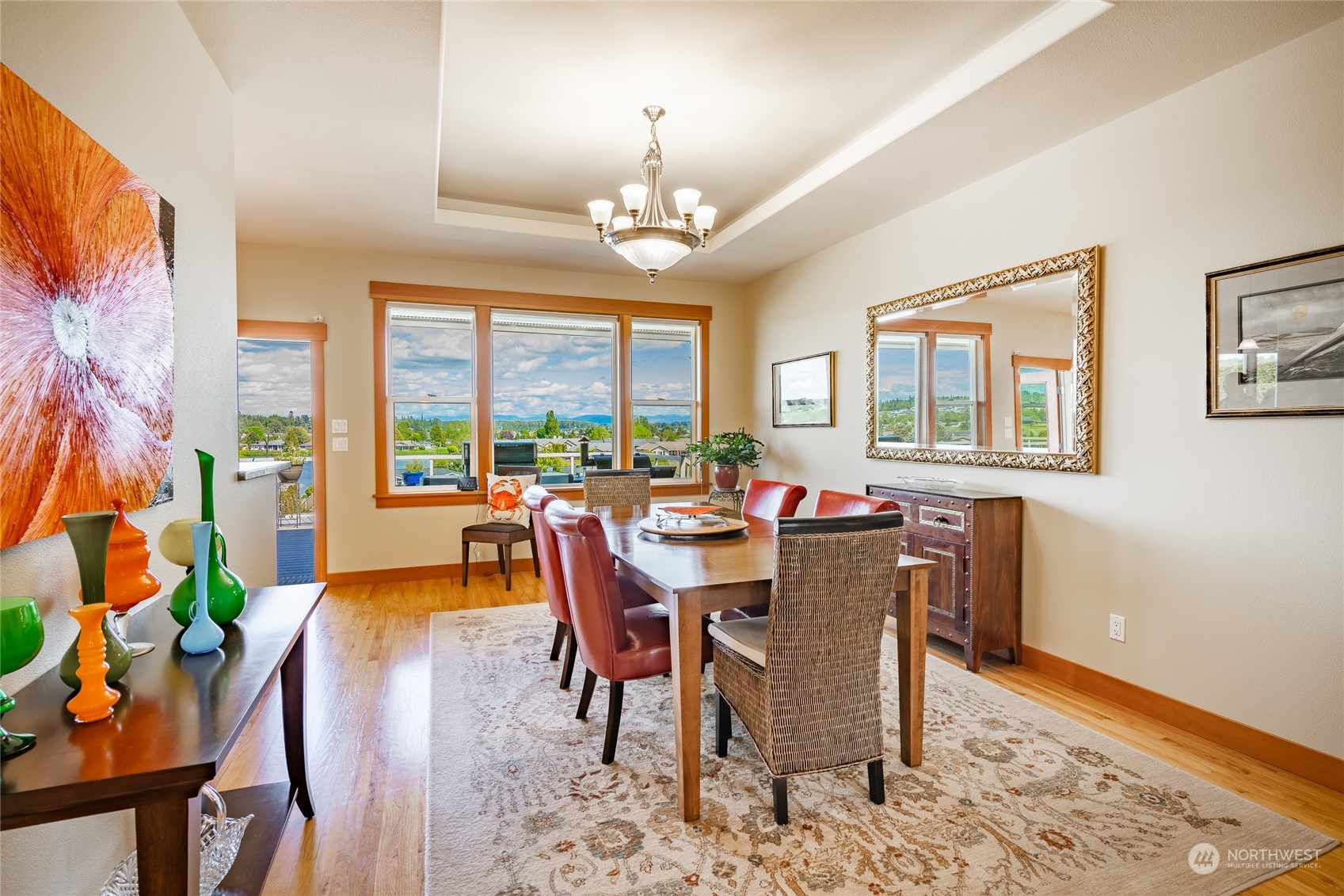 8148 Comox Road Blaine, WA 98230 - Photo 5 of 40 a dining room with furniture a chandelier and wooden floor