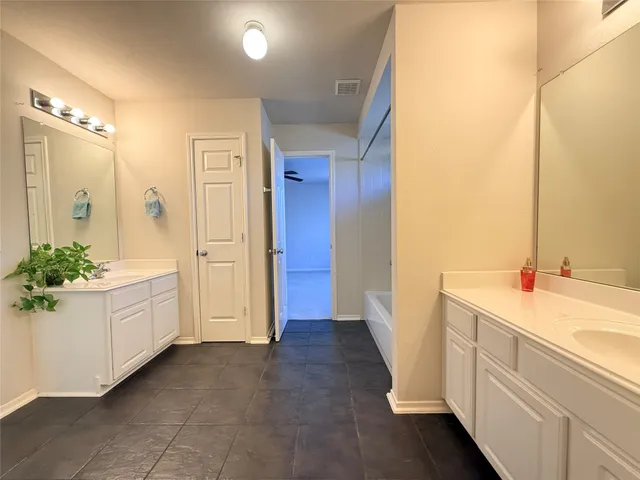 a bathroom with a sink and a bathtub