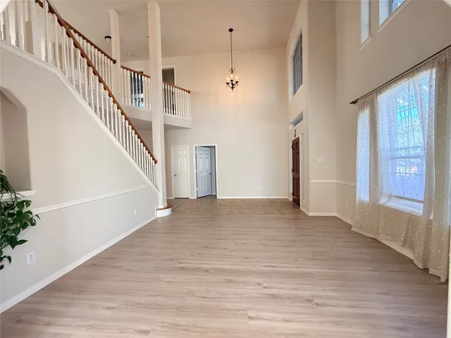 a view of an entryway with wooden floor