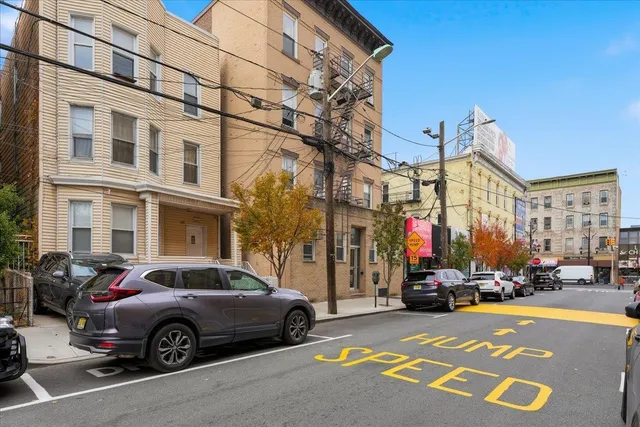 a view of a street with cars