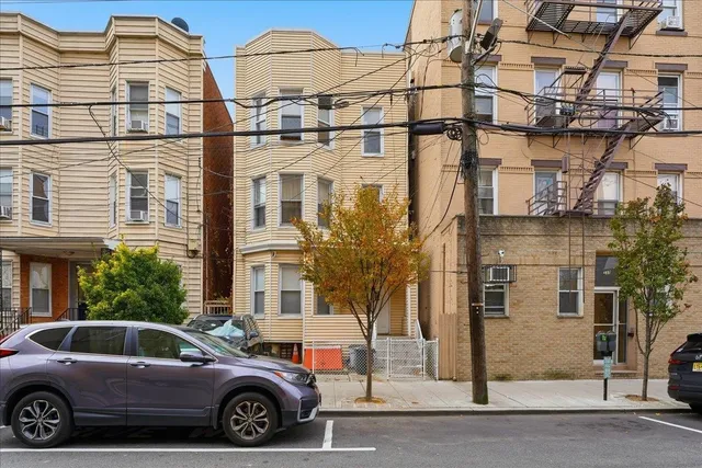 a car parked in front of a house