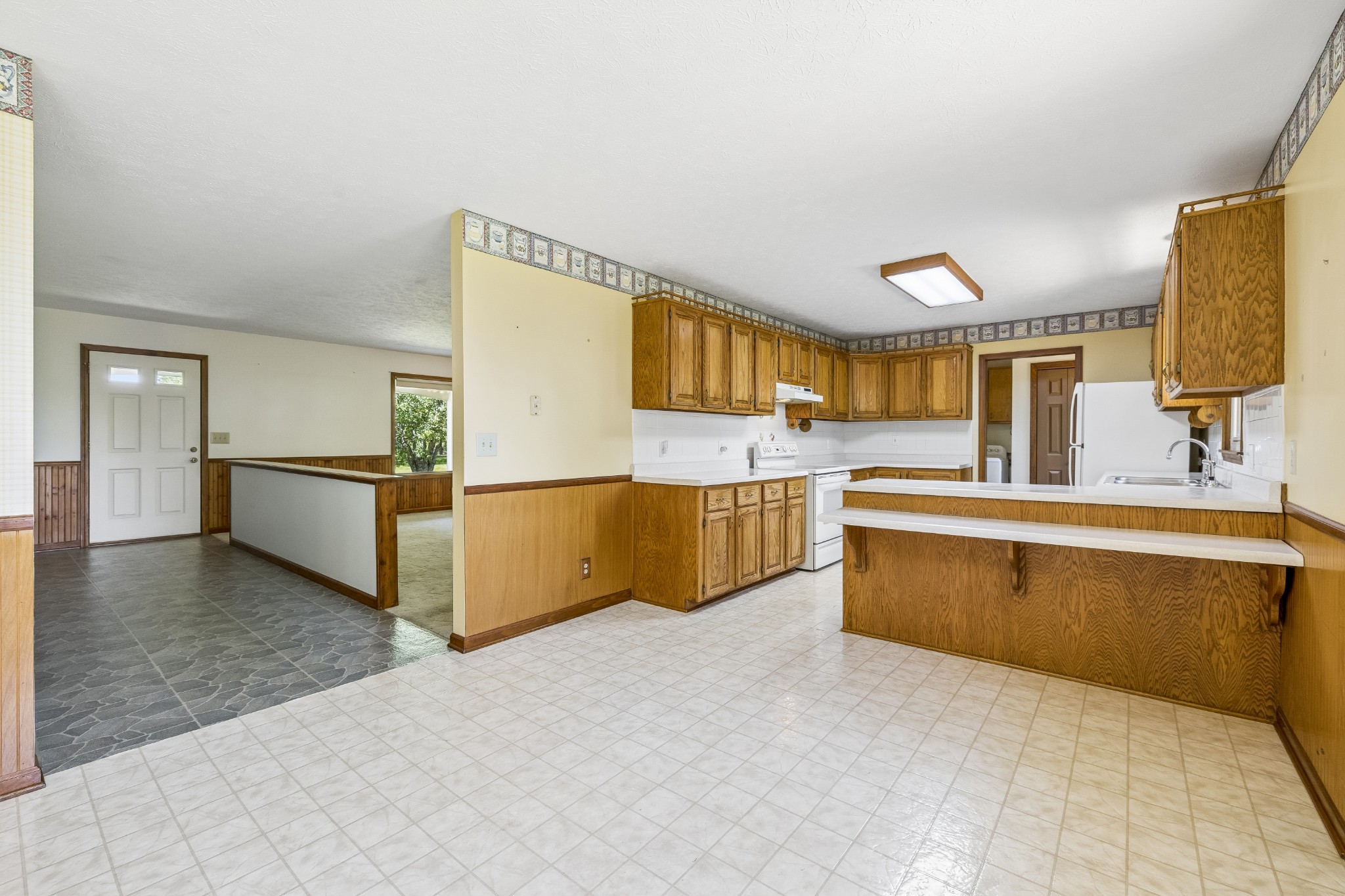 1690 Lawrence Lane Springfield, TN 37172 - Photo 12 of 64 a large kitchen with stainless steel appliances granite countertop a sink and cabinets