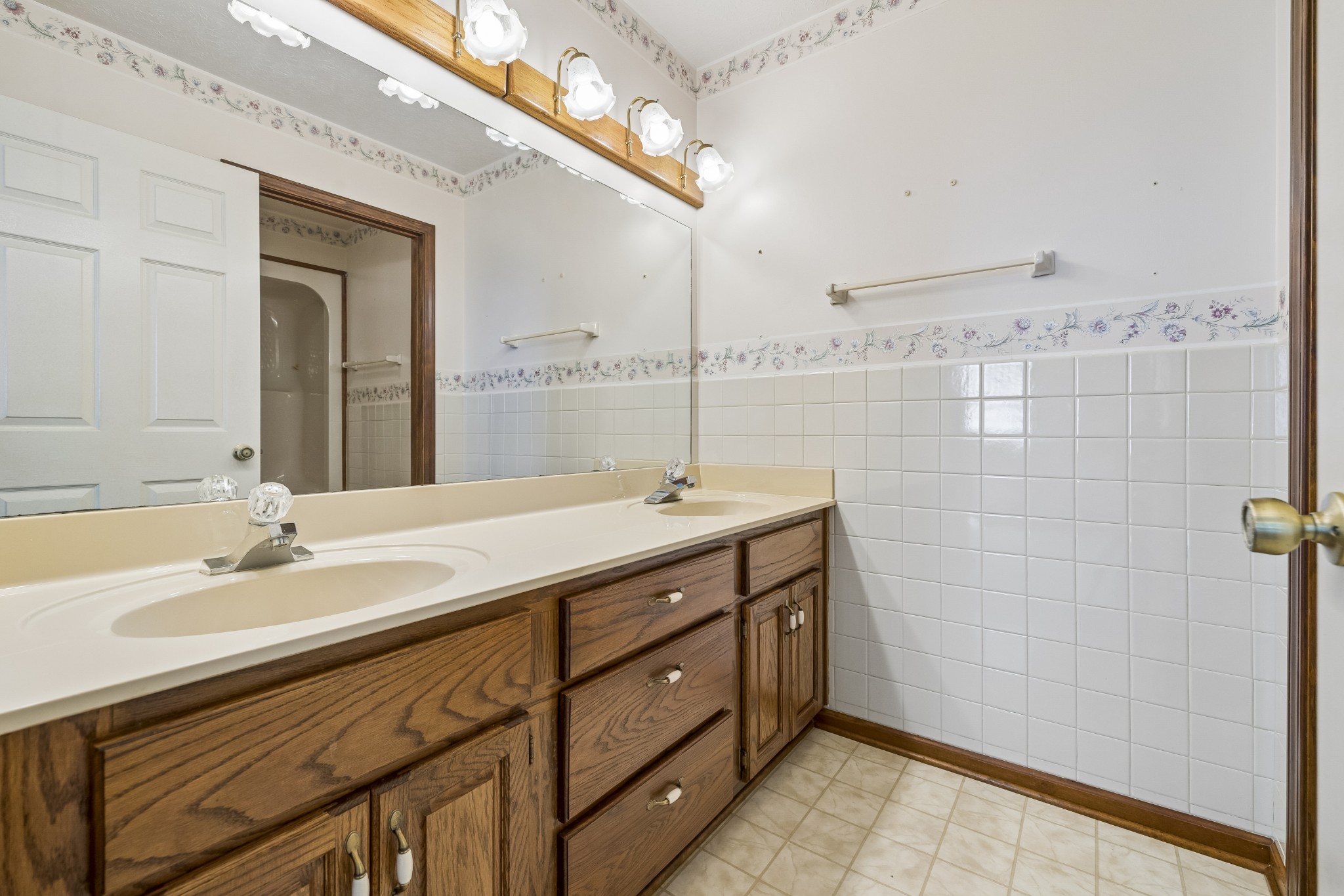 1690 Lawrence Lane Springfield, TN 37172 - Photo 18 of 64 a bathroom with a double vanity sink and a mirror