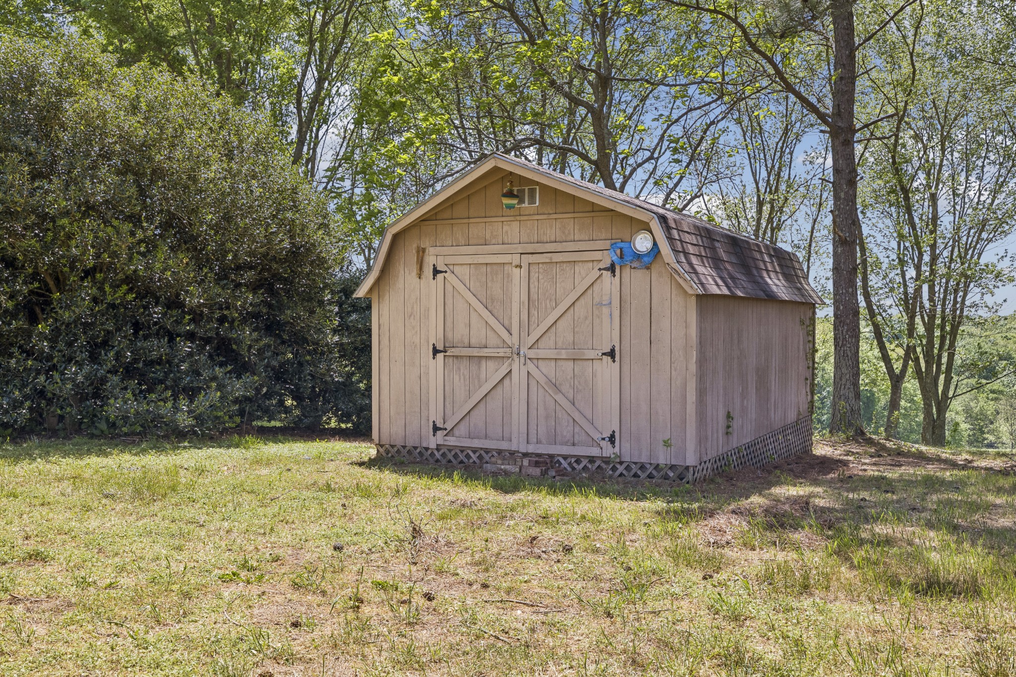 1690 Lawrence Lane Springfield, TN 37172 - Photo 32 of 64 a view of wooden house with a yard and large trees