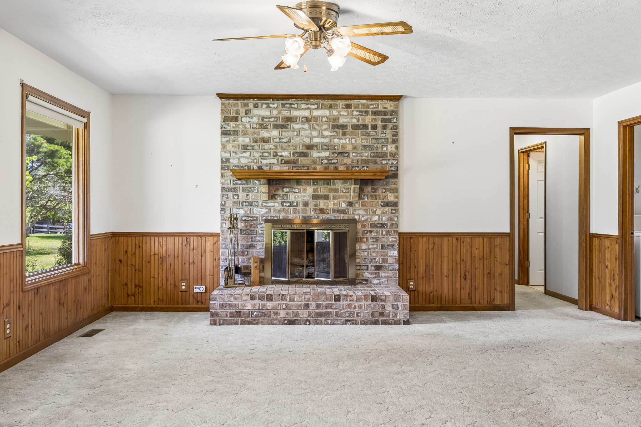 1690 Lawrence Lane Springfield, TN 37172 - Photo 6 of 64 an empty room with windows and fireplace