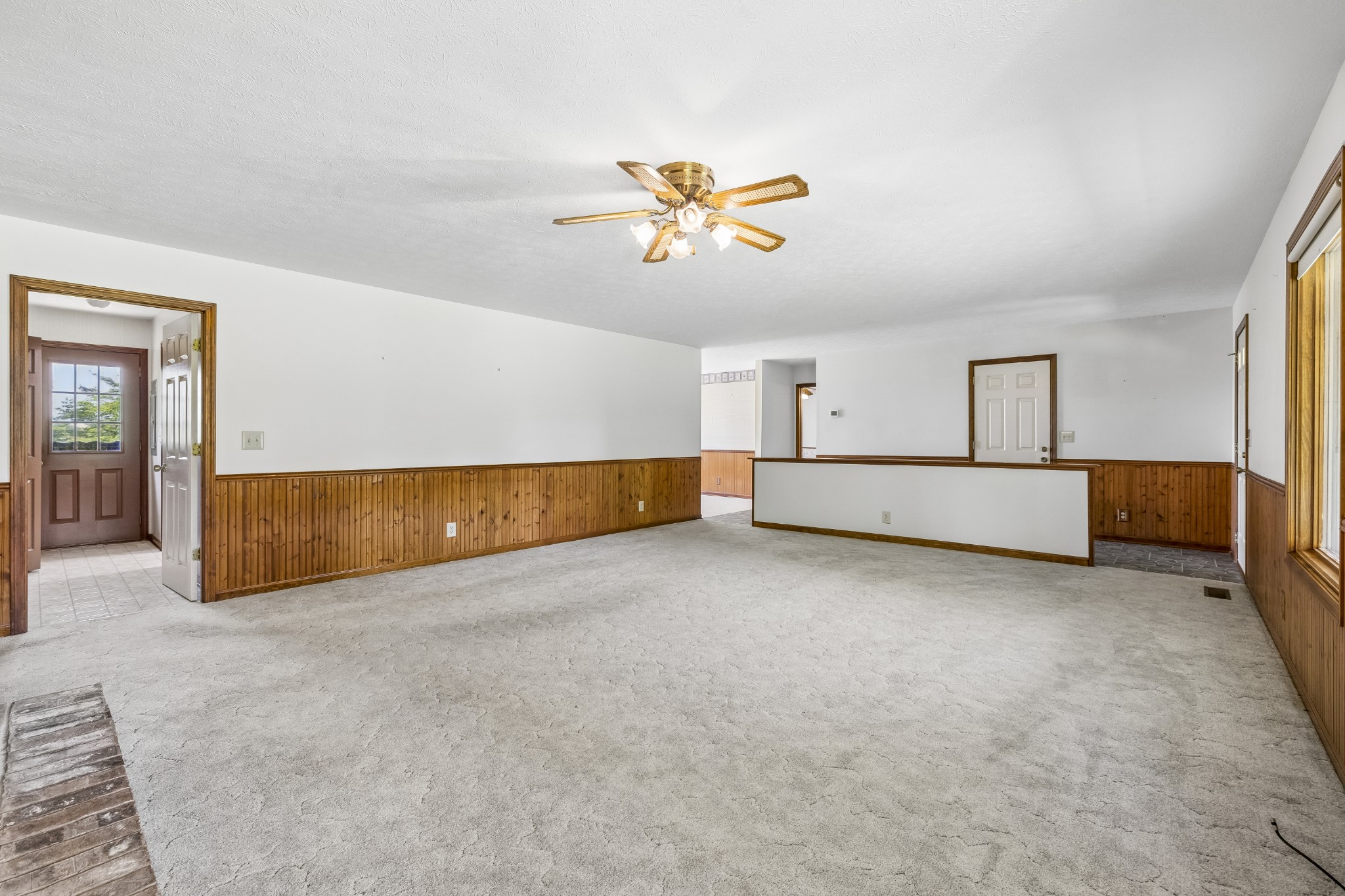1690 Lawrence Lane Springfield, TN 37172 - Photo 8 of 64 an empty room with chandelier fan and windows