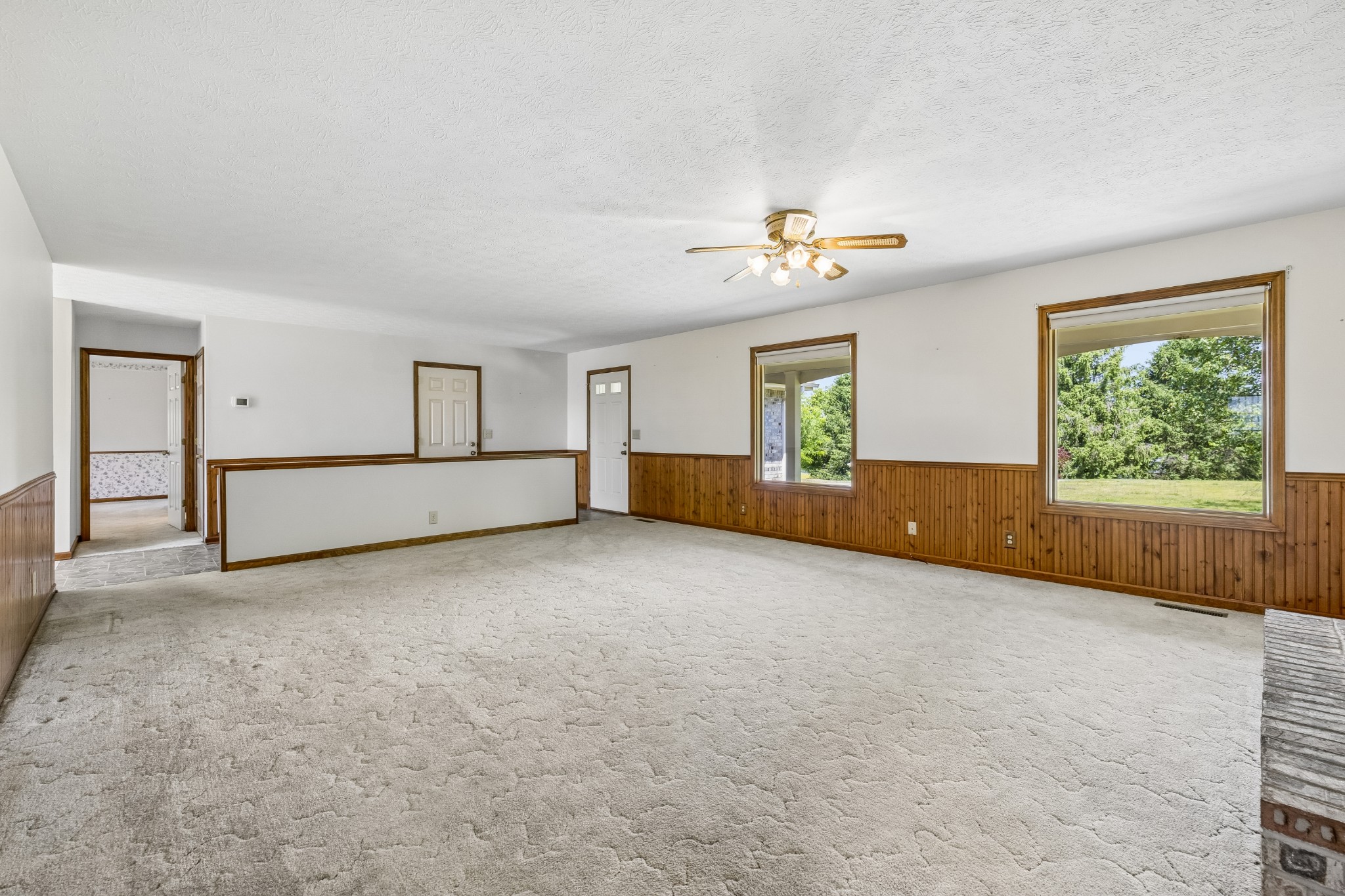 1690 Lawrence Lane Springfield, TN 37172 - Photo 9 of 64 an empty room with windows and chandelier fan