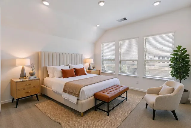 a bedroom with a bed and a couch