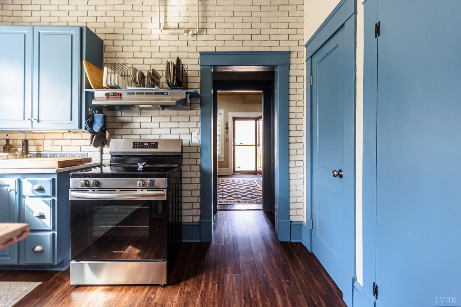 172 Pecan Street Pamplin, VA 23958 - Photo 17 of 40 a kitchen with a wooden floor and a stove top oven