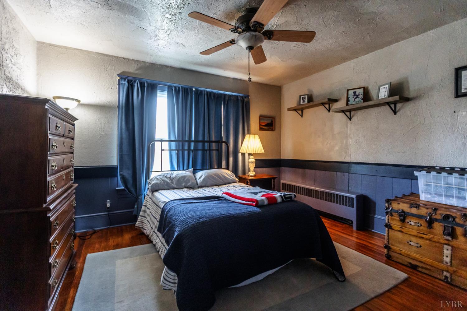 172 Pecan Street Pamplin, VA 23958 - Photo 25 of 40 a bedroom with a bed and a flat tv screen