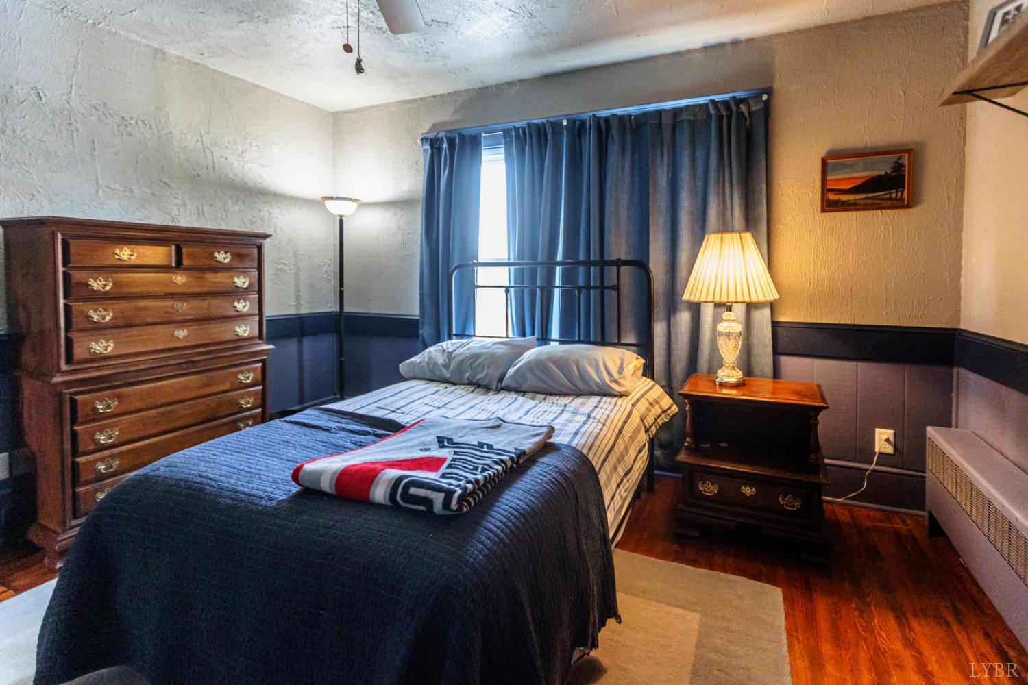172 Pecan Street Pamplin, VA 23958 - Photo 26 of 40 a bedroom with a bed and a lamp