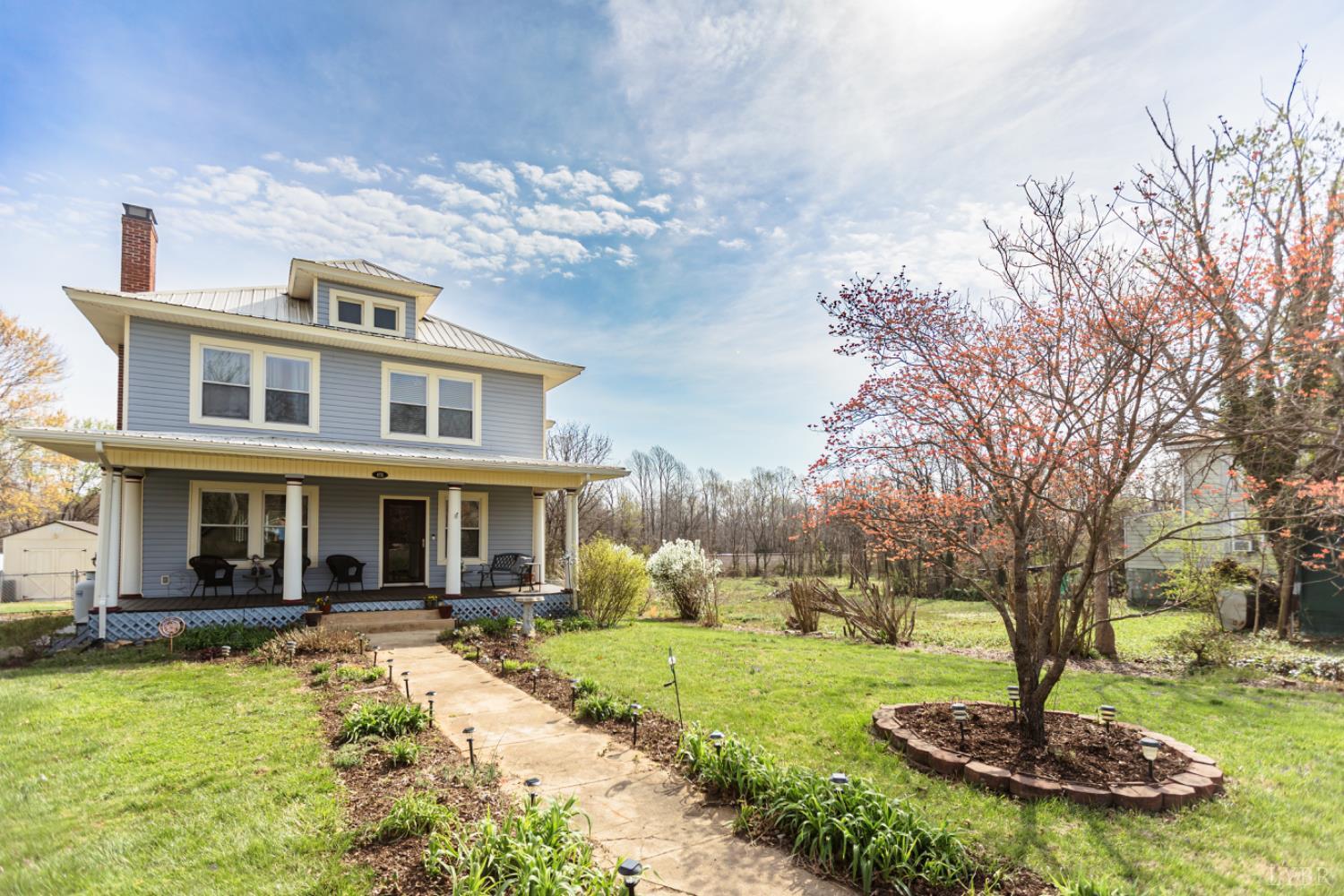 172 Pecan Street Pamplin, VA 23958 - Photo 3 of 40 a front view of a house with yard and trees