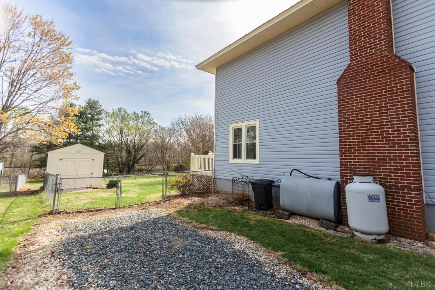 172 Pecan Street Pamplin, VA 23958 - Photo 34 of 40 a view of a backyard with plants and garden