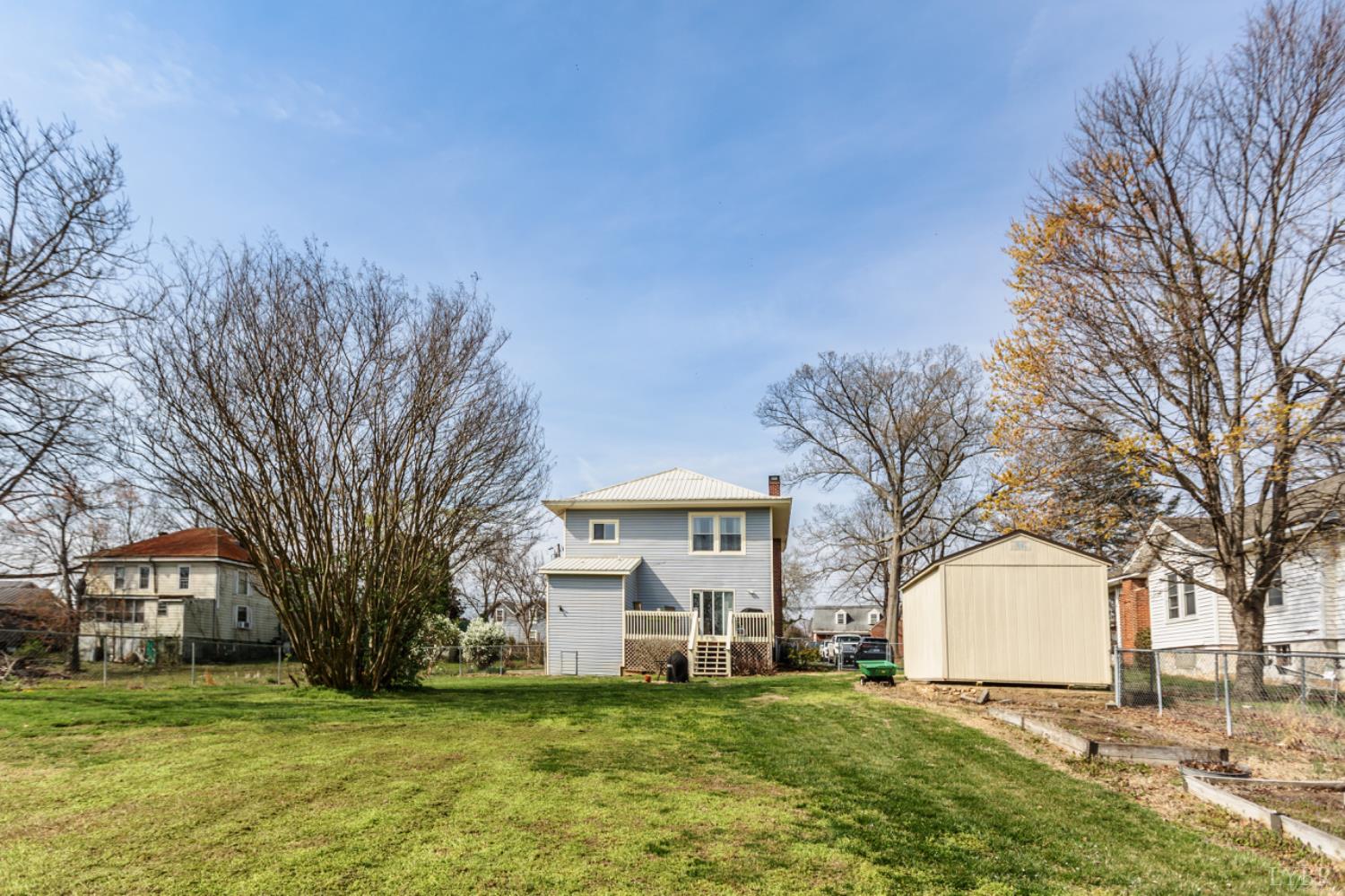 172 Pecan Street Pamplin, VA 23958 - Photo 40 of 40 a front view of a house with a yard covered with trees