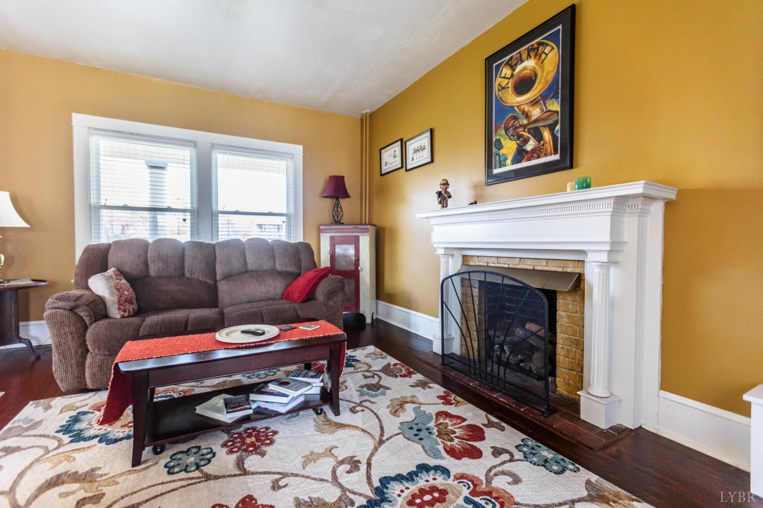 172 Pecan Street Pamplin, VA 23958 - Photo 9 of 40 a living room with furniture and a fireplace