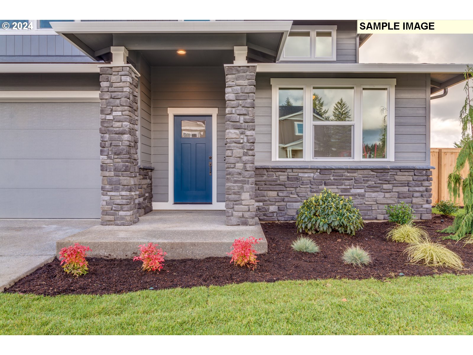 1301 North Kalani Loop, Unit 55 Ridgefield, WA 98642 - Photo 3 of 33 a front view of a house with a yard