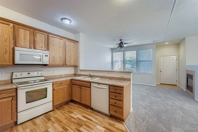 a kitchen with stainless steel appliances granite countertop a stove and a sink