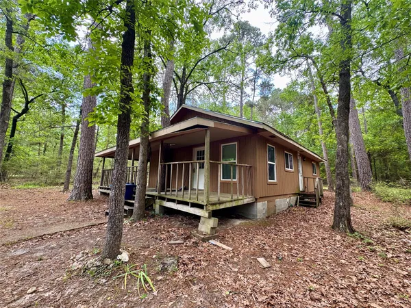 a house with trees in the background