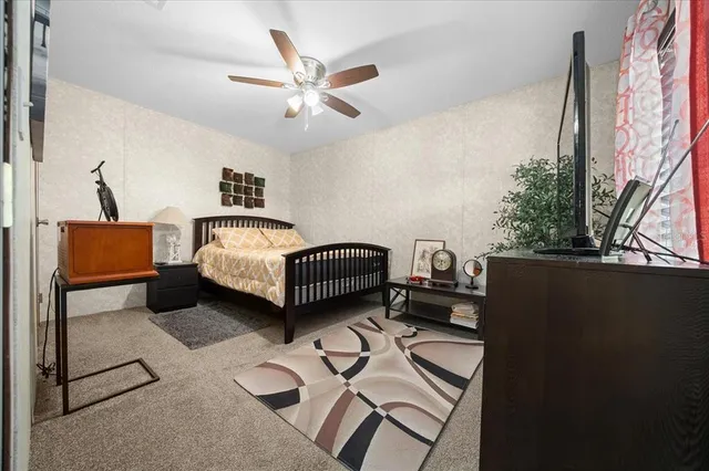 a bathroom with a toilet a sink and a mirror