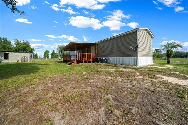 a view of a house with a big yard