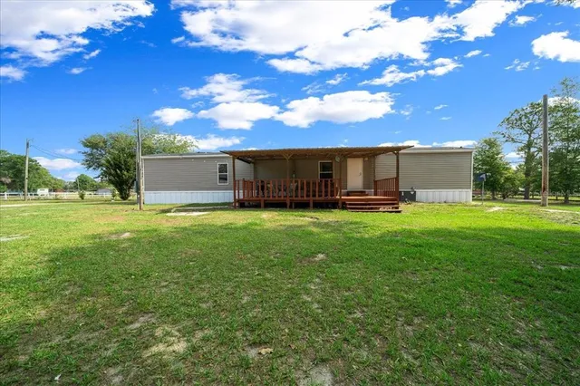 a view of a house with a big yard