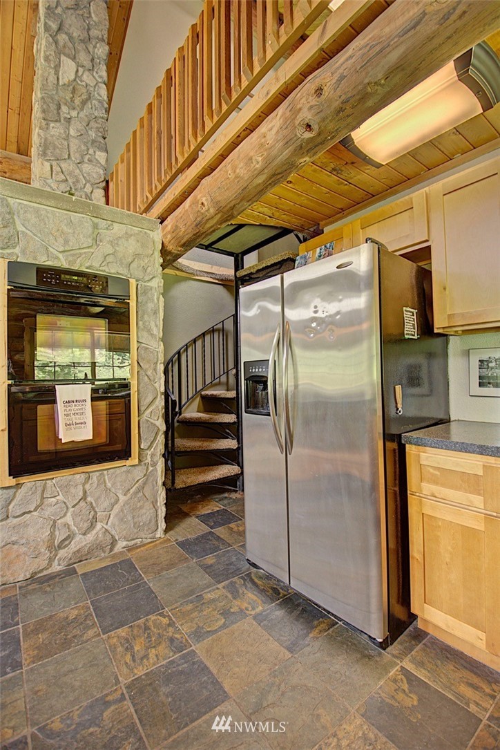 16634 Williams Lane Southwest Rochester, WA 98579 - Photo 14 of 33 a view of a refrigerator in the kitchen