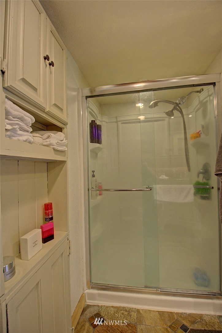 16634 Williams Lane Southwest Rochester, WA 98579 - Photo 19 of 33 a bathroom with a shower and a sink