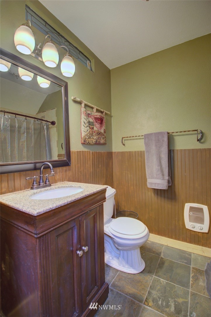 16634 Williams Lane Southwest Rochester, WA 98579 - Photo 21 of 33 a bathroom with a sink mirror vanity and toilet