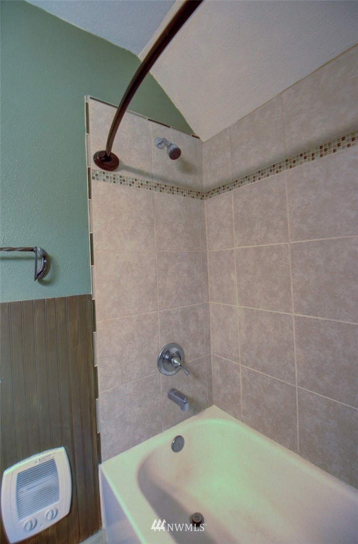 16634 Williams Lane Southwest Rochester, WA 98579 - Photo 22 of 33 a bathroom with a tub and a shower