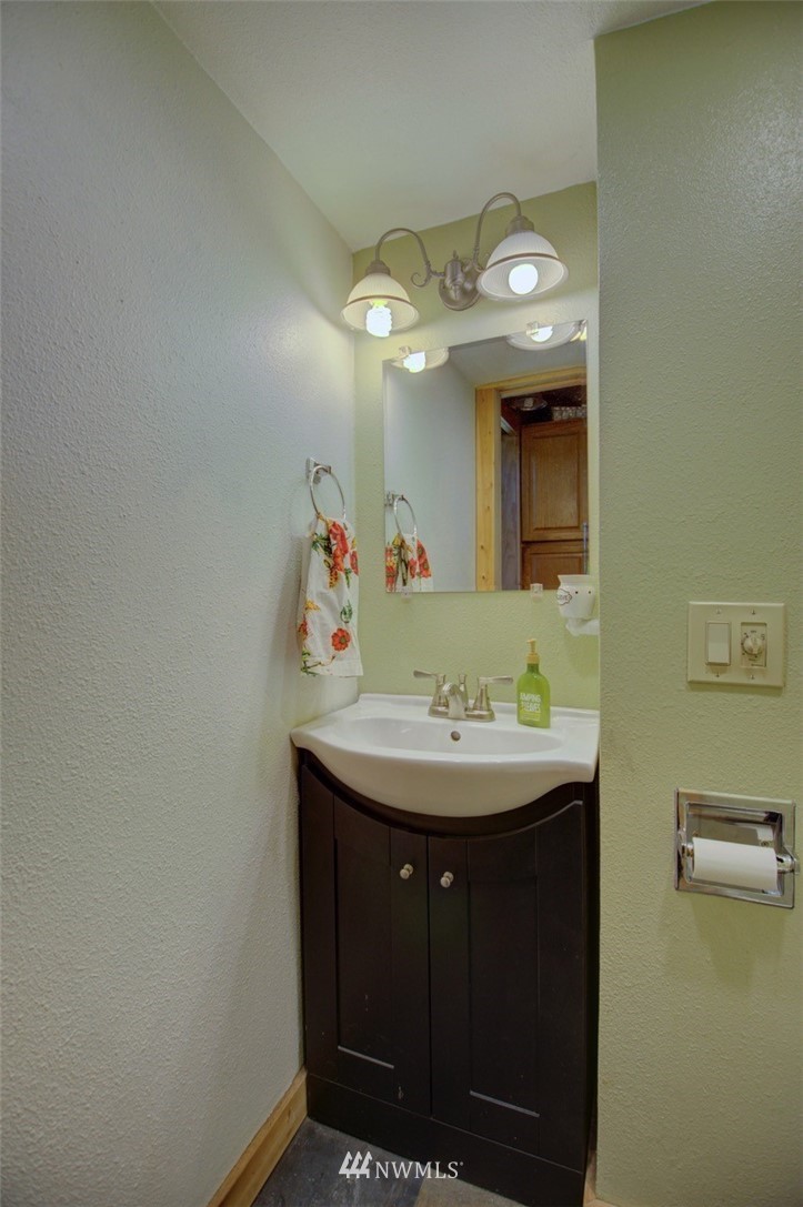 16634 Williams Lane Southwest Rochester, WA 98579 - Photo 24 of 33 a bathroom with a sink and a mirror