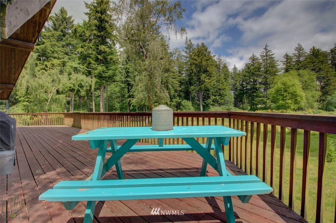 16634 Williams Lane Southwest Rochester, WA 98579 - Photo 25 of 33 a view of a deck with furniture and wooden fence