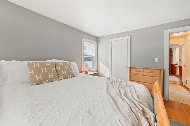 a bedroom with a bed and a fireplace