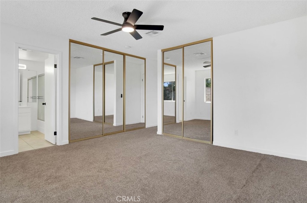 1012 Lightcap Street Lancaster, CA 93535 - Photo 21 of 33 a view of empty room with wooden floor and ceiling fan