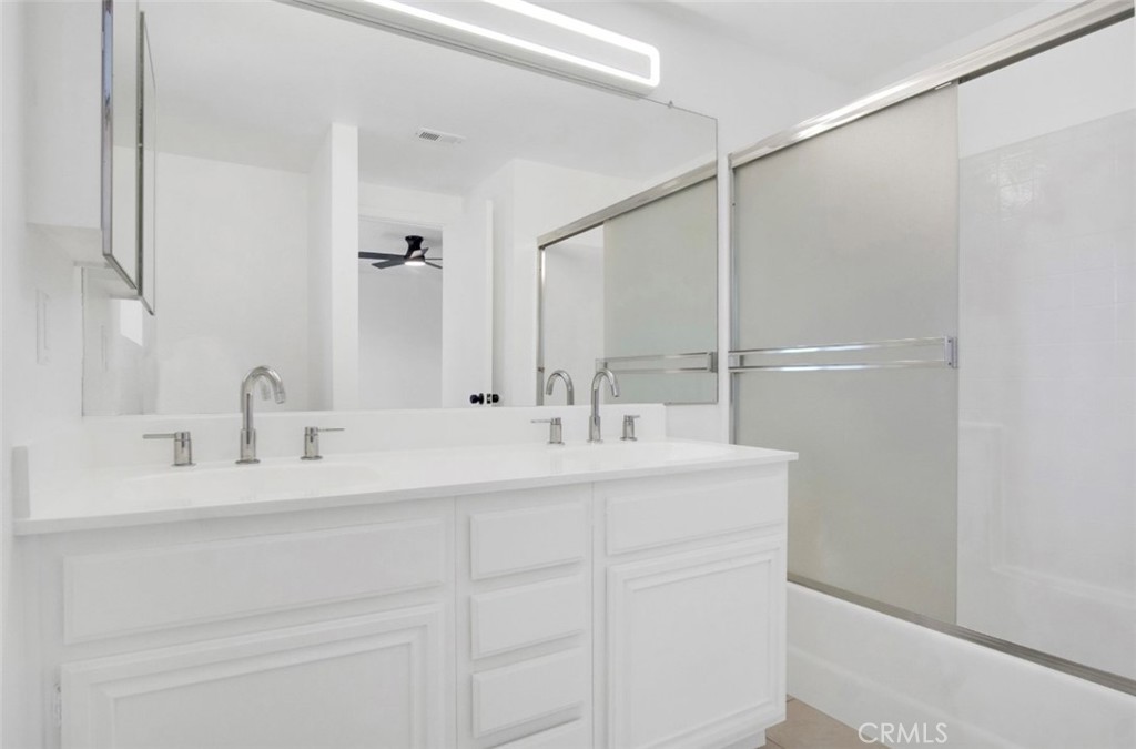1012 Lightcap Street Lancaster, CA 93535 - Photo 22 of 33 a bathroom with a sink and a mirror